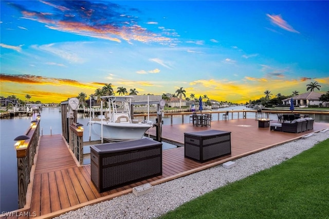 view of dock featuring a water view and outdoor lounge area