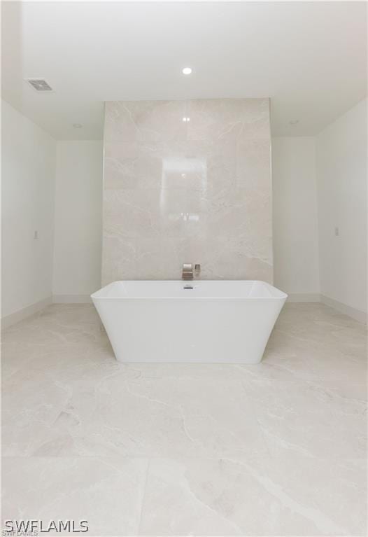 bathroom featuring tile flooring and tile walls