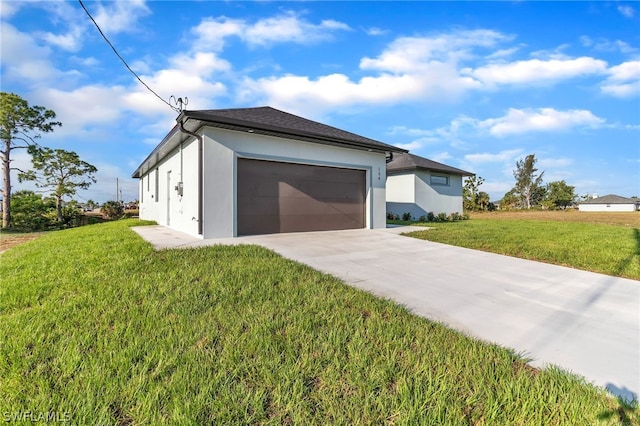 view of front facade with a garage and a front lawn