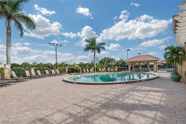 view of swimming pool featuring a gazebo and a patio