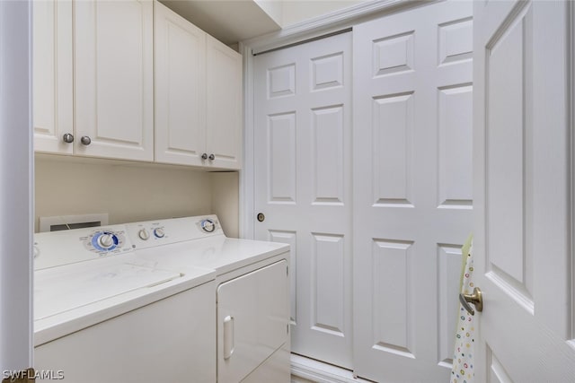 laundry area featuring hookup for a washing machine, cabinets, washer and dryer, and light tile floors