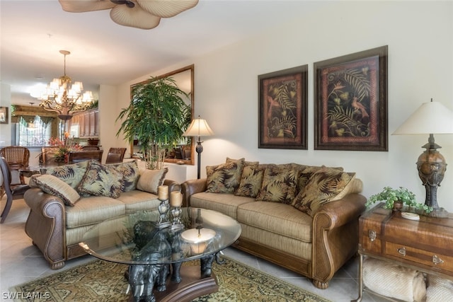 tiled living room with ceiling fan with notable chandelier