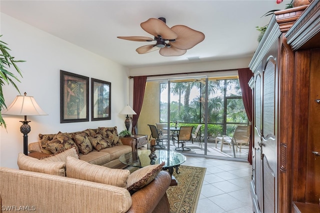 tiled living room with ceiling fan