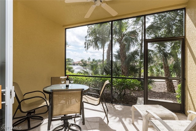 sunroom with ceiling fan and a wealth of natural light