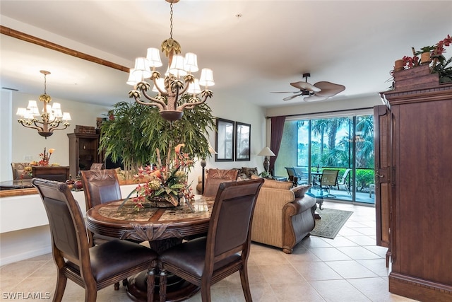 tiled dining space featuring ceiling fan with notable chandelier