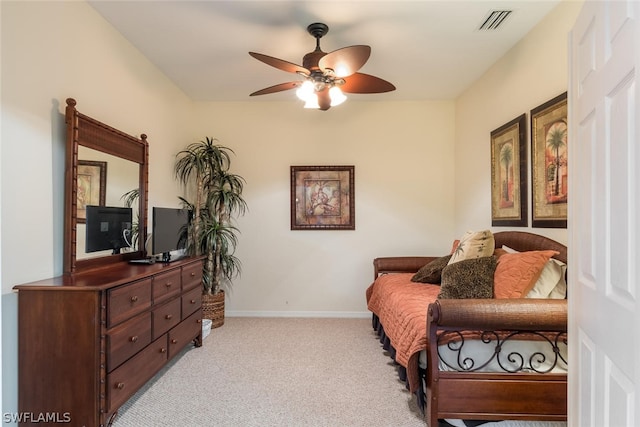 sitting room featuring light carpet and ceiling fan