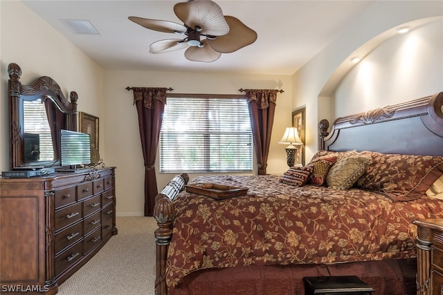 bedroom featuring light carpet and ceiling fan