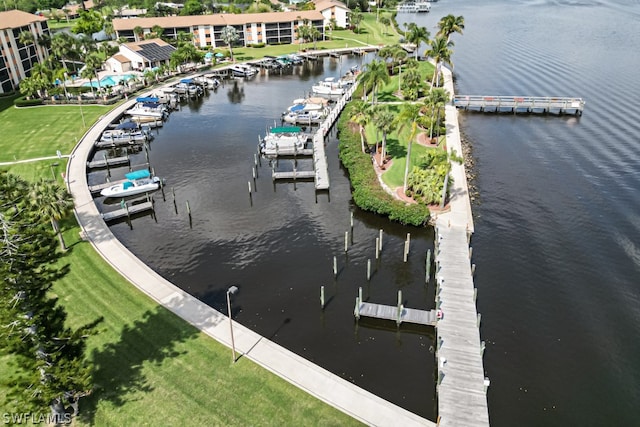 view of dock featuring a water view and a lawn