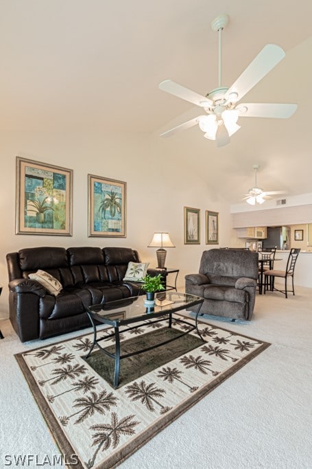 living room featuring ceiling fan, light colored carpet, and high vaulted ceiling