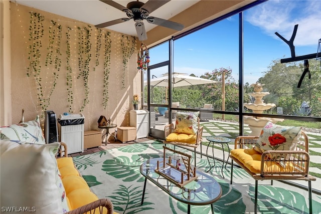 sunroom featuring ceiling fan