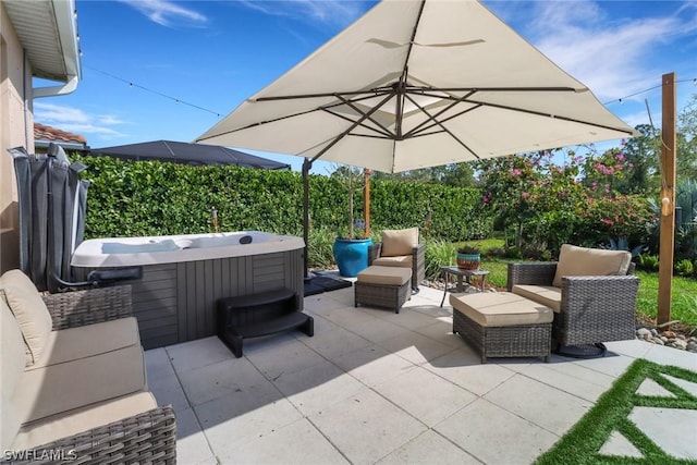 view of patio / terrace with a hot tub