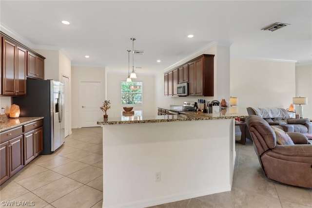 kitchen with ornamental molding, pendant lighting, stone countertops, and appliances with stainless steel finishes