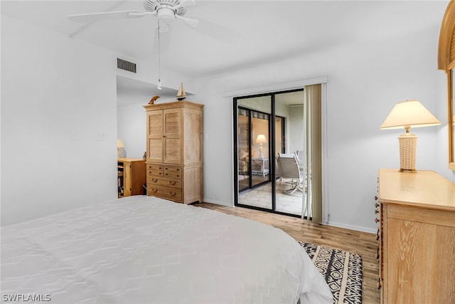 bedroom with visible vents, baseboards, a ceiling fan, wood finished floors, and access to exterior