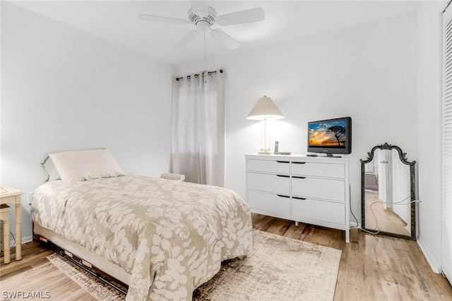 bedroom with ceiling fan and light wood-type flooring