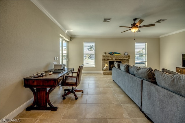 interior space featuring a brick fireplace, ornamental molding, light tile flooring, and ceiling fan