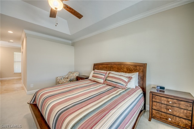 carpeted bedroom featuring crown molding and ceiling fan