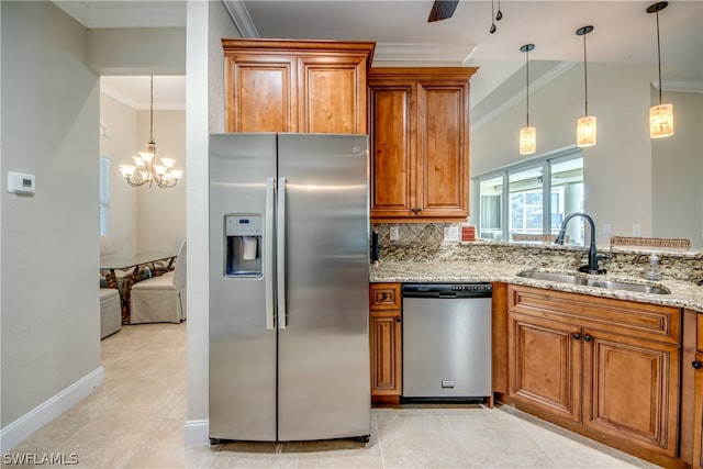 kitchen with ceiling fan with notable chandelier, appliances with stainless steel finishes, sink, light tile floors, and ornamental molding