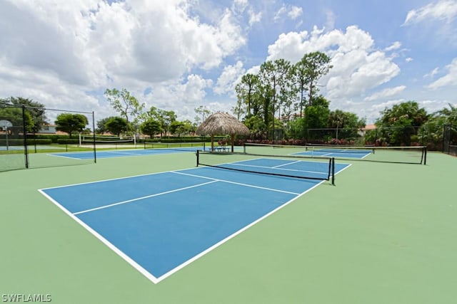 374 Dover Pl Unit 803, Naples, FL 34104 - view of tennis court with fence and community basketball court