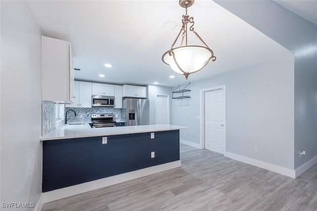 374 Dover Pl Unit 803, Naples, FL 34104 - kitchen with decorative backsplash, light countertops, baseboards, appliances with stainless steel finishes, and white cabinetry