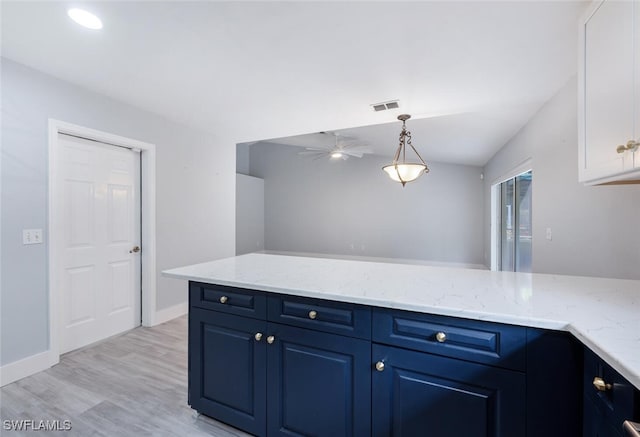 374 Dover Pl Unit 803, Naples, FL 34104 - kitchen with a ceiling fan, light stone countertops, blue cabinets, visible vents, and white cabinets
