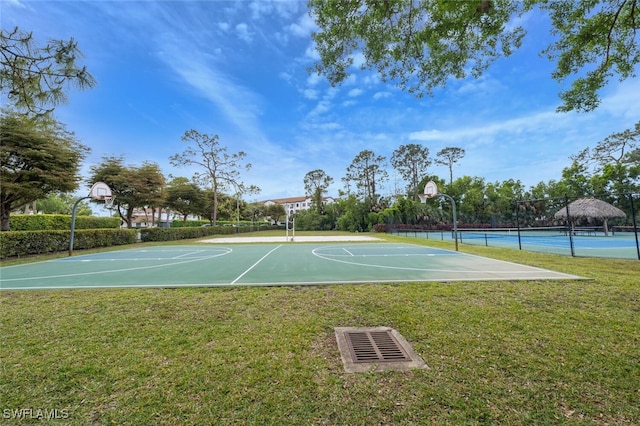 374 Dover Pl Unit 803, Naples, FL 34104 - view of basketball court with community basketball court, fence, and a yard