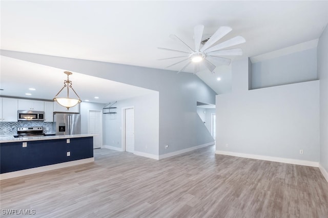 374 Dover Pl Unit 803, Naples, FL 34104 - unfurnished living room with vaulted ceiling, recessed lighting, baseboards, light wood finished floors, and ceiling fan