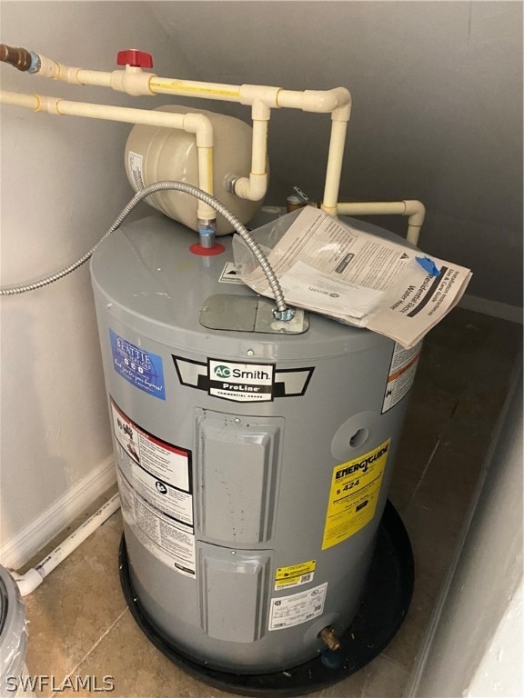 utility room featuring electric water heater