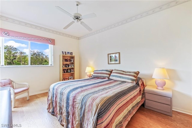 bedroom featuring light hardwood / wood-style flooring and ceiling fan