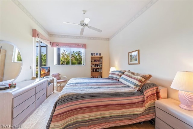 bedroom with ceiling fan and light hardwood / wood-style flooring