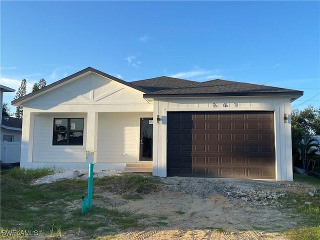 view of front of property with a garage