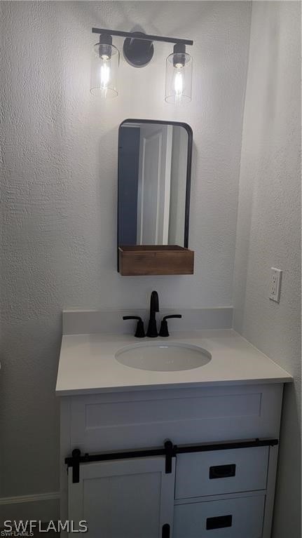 bathroom featuring oversized vanity