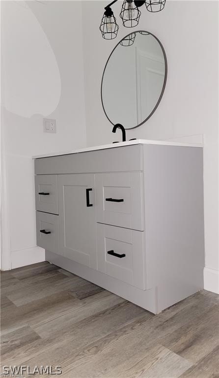 interior space with light hardwood / wood-style floors and vanity