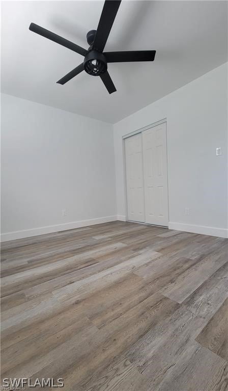 unfurnished bedroom featuring a closet, ceiling fan, and light hardwood / wood-style floors