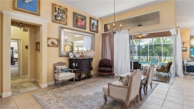 living area featuring ceiling fan and light tile patterned floors