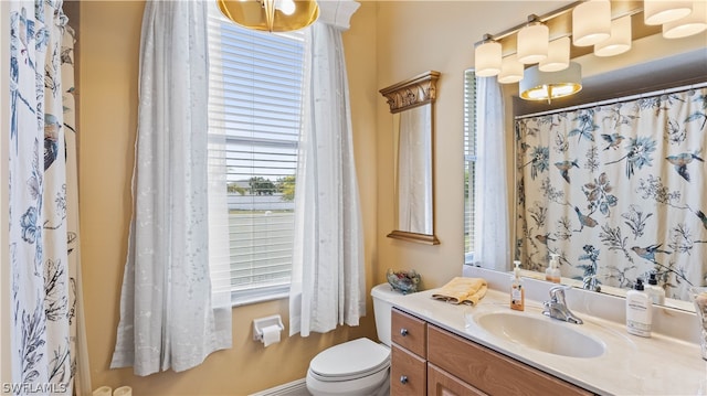 bathroom with vanity and toilet