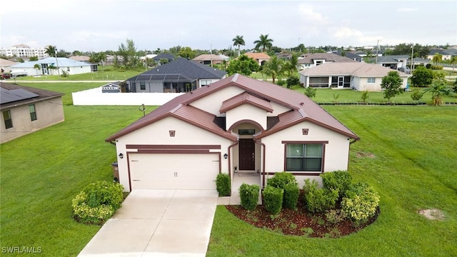 view of front facade with a garage and a front yard