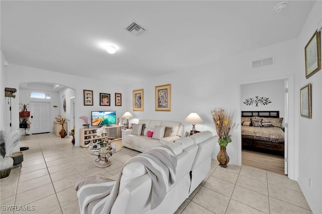 living room with light tile patterned floors