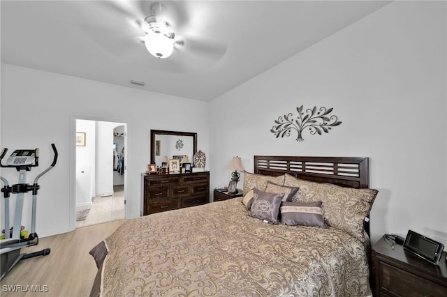 bedroom with ceiling fan and light hardwood / wood-style flooring