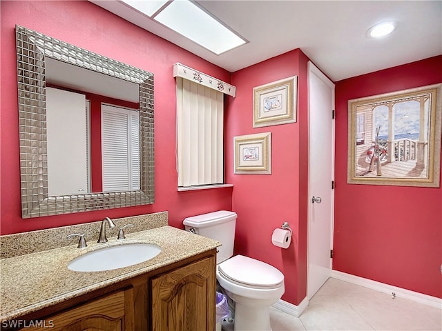 bathroom with tile patterned floors, vanity, and toilet