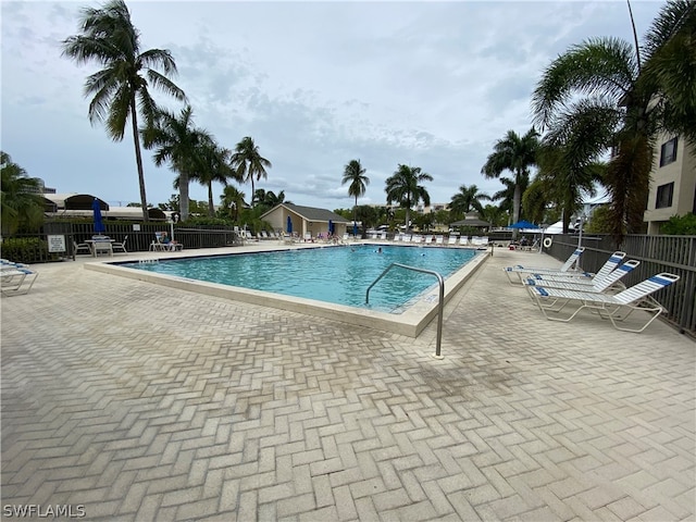 view of swimming pool featuring a patio area