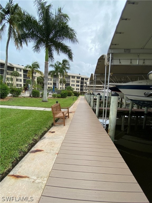 dock area featuring a lawn