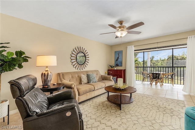 living area featuring ceiling fan and light tile patterned floors