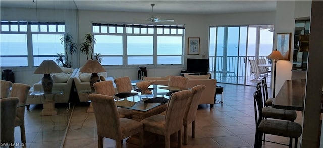 tiled dining room with ceiling fan