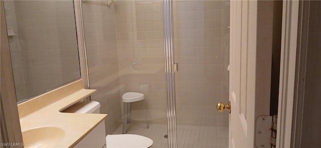 full bath featuring vanity, a shower stall, and toilet