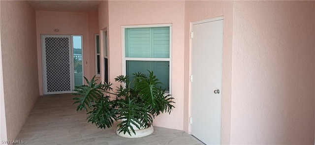 property entrance featuring stucco siding