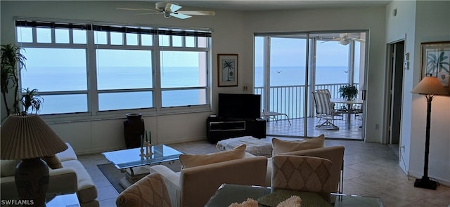 tiled living room featuring ceiling fan