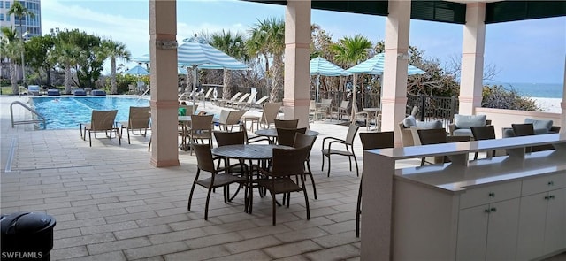 view of patio featuring a community pool