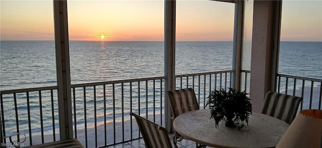 balcony at dusk with a water view