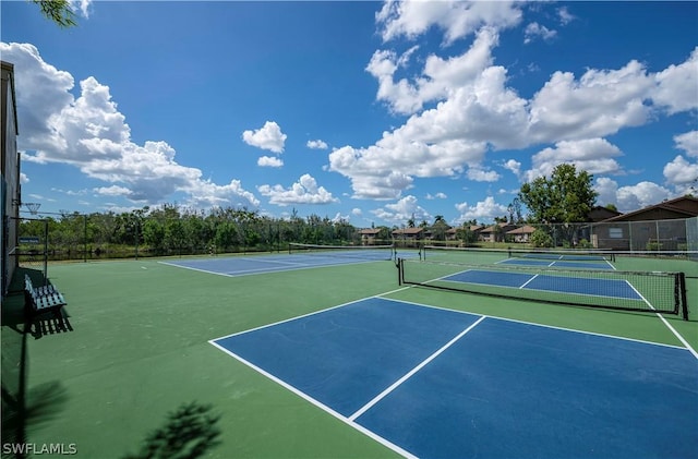 view of sport court with basketball hoop