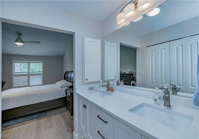 bathroom featuring vanity, ceiling fan, and hardwood / wood-style flooring